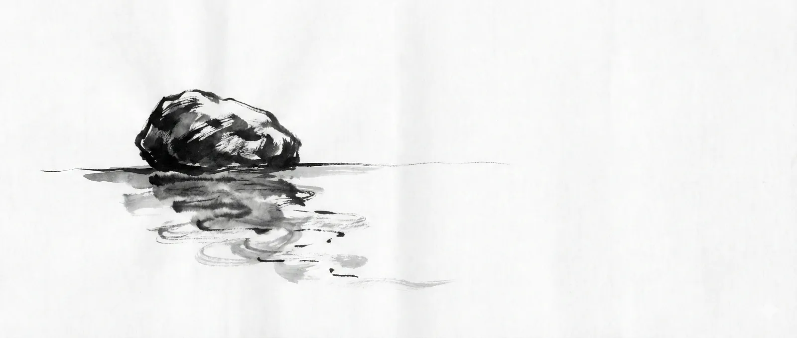A stone sits solid and certain above the waterline, its reflection dissolving into something less sure of itself
